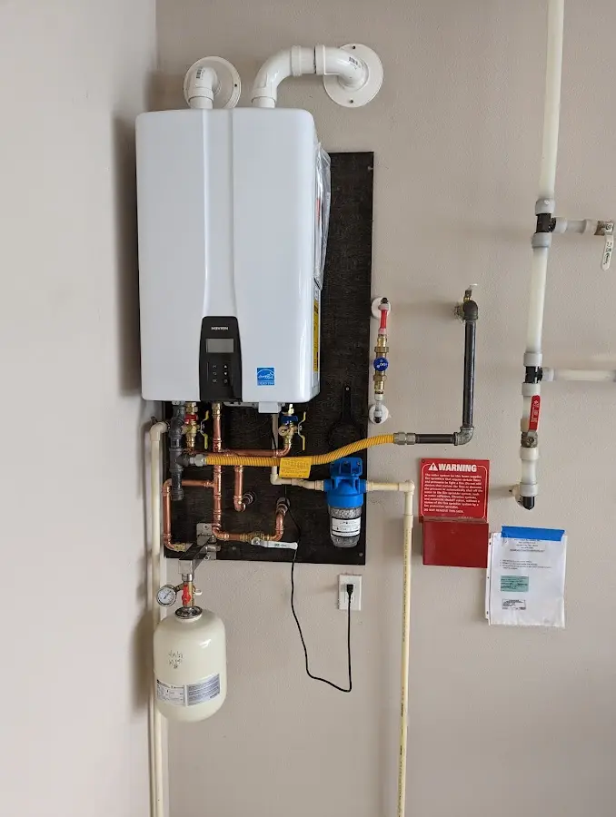 Professional plumber installing copper piping in a Wetumpka home